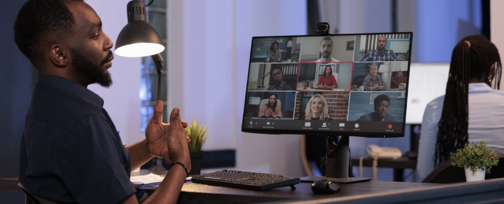 A man in an online meeting with several people. He is sharing his ideas about thought leadership